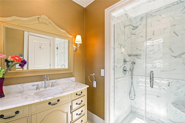 bathroom featuring vanity, an enclosed shower, and crown molding