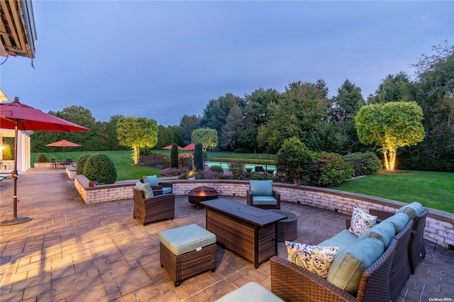 view of patio / terrace featuring an outdoor fire pit