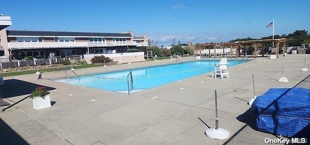 view of swimming pool featuring a patio