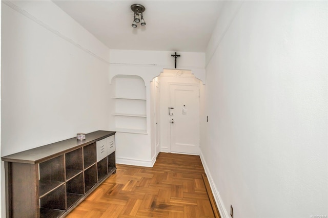 corridor with parquet flooring