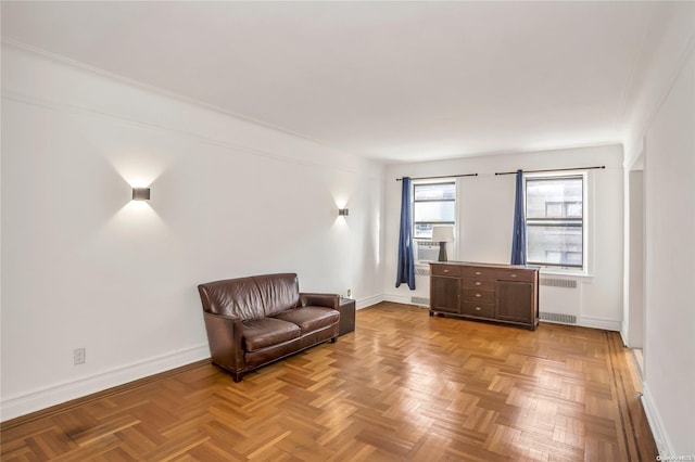 sitting room featuring light parquet floors and radiator