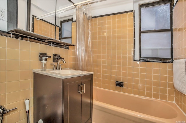 bathroom featuring shower / bath combo, vanity, tile walls, and backsplash