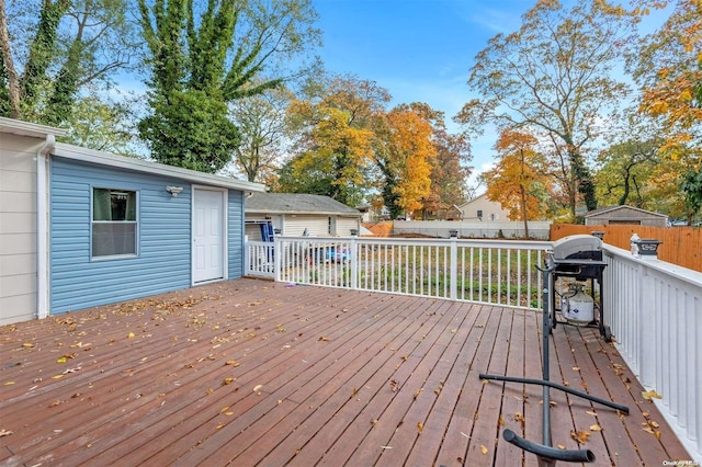 wooden terrace with area for grilling