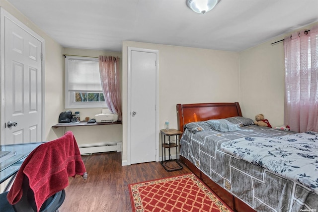 bedroom featuring dark hardwood / wood-style floors and baseboard heating