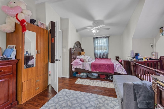 bedroom featuring vaulted ceiling, ceiling fan, and dark hardwood / wood-style floors