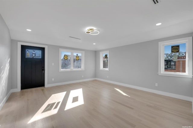 foyer with light wood-type flooring