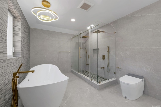 bathroom with toilet, tile walls, and shower with separate bathtub