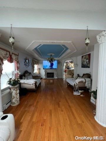 bedroom featuring vaulted ceiling and hardwood / wood-style flooring