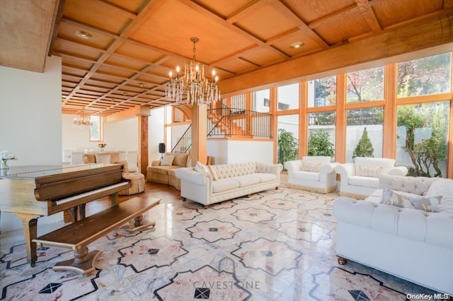 sunroom with a notable chandelier and coffered ceiling