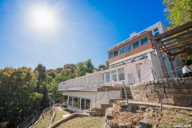 view of side of home with a pergola