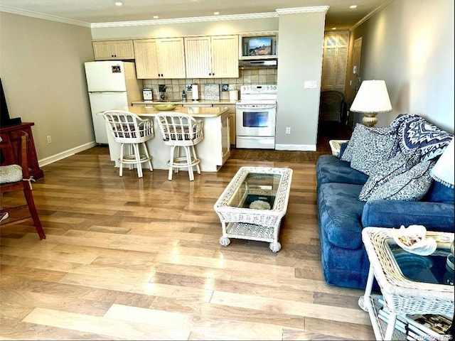 living room featuring light wood-type flooring and crown molding