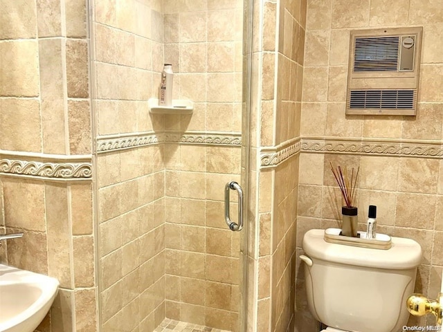 bathroom featuring toilet, tile walls, and walk in shower