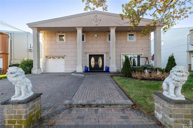 view of front of home with a garage