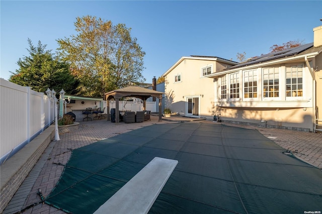 exterior space featuring a gazebo and a patio area