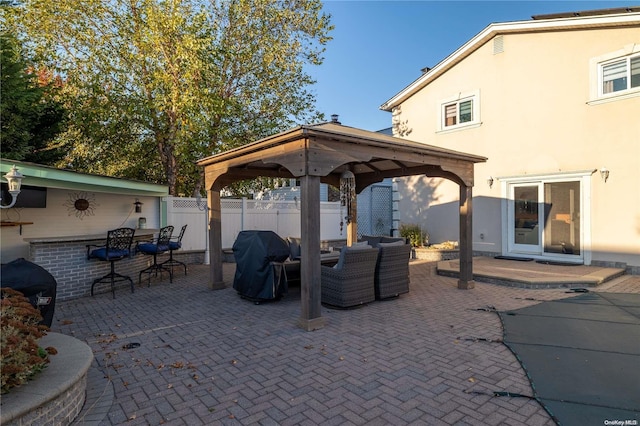 view of patio / terrace with a gazebo, a grill, and an outdoor living space