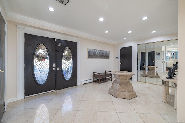 foyer entrance featuring french doors and ornamental molding