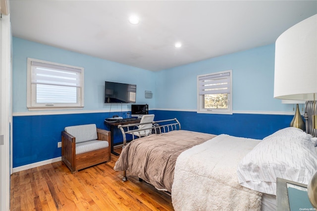 bedroom with wood-type flooring