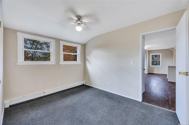 spare room with ceiling fan, dark hardwood / wood-style flooring, lofted ceiling, and a baseboard heating unit