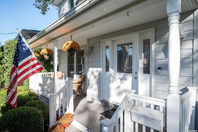 view of exterior entry featuring a porch