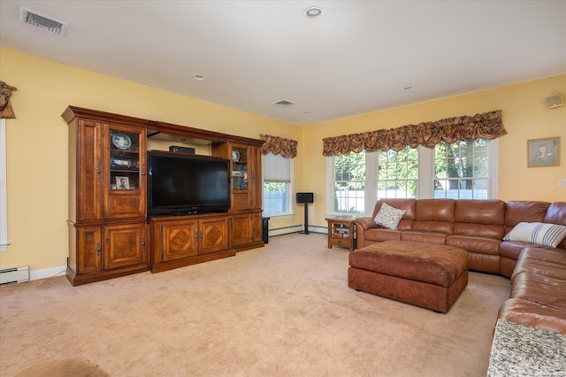 carpeted living room with a baseboard heating unit