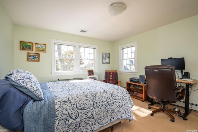 bedroom featuring light colored carpet