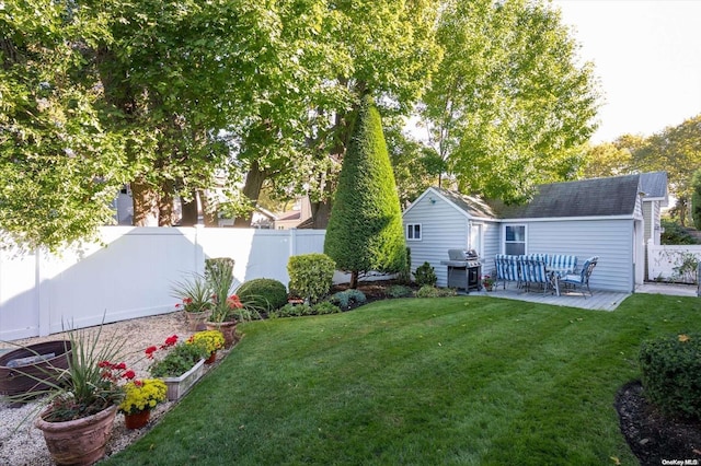 view of yard with a patio and an outdoor structure