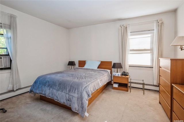 carpeted bedroom with a baseboard radiator