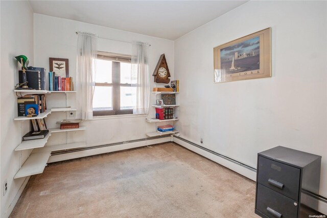 interior space featuring carpet and a baseboard radiator