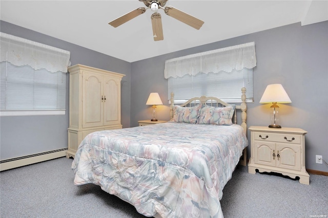 carpeted bedroom featuring baseboard heating and ceiling fan