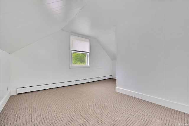 bonus room featuring a baseboard radiator and vaulted ceiling