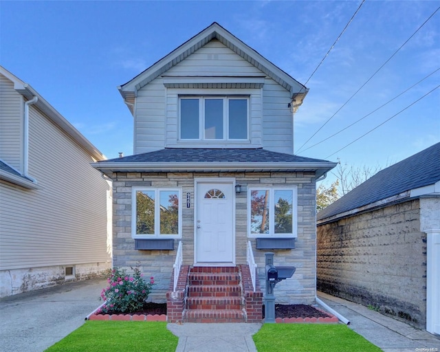 94-51 226th St, Floral Park, NY 11001 - view of front of property with entry steps, stone siding, and a shingled roof