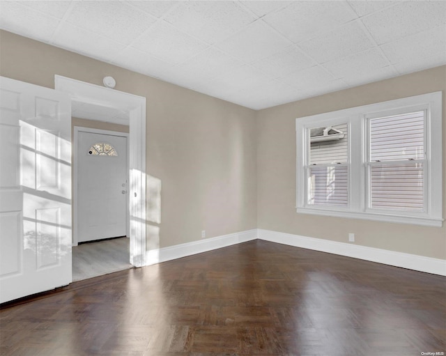 spare room with parquet floors