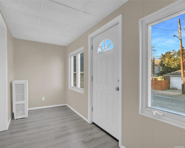 94-51 226th St, Floral Park, NY 11001 - entryway with wood finished floors, a paneled ceiling, and baseboards