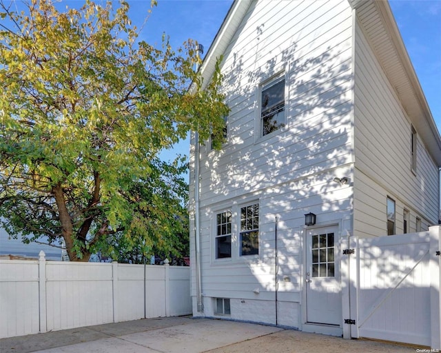 94-51 226th St, Floral Park, NY 11001 - view of side of home with a gate