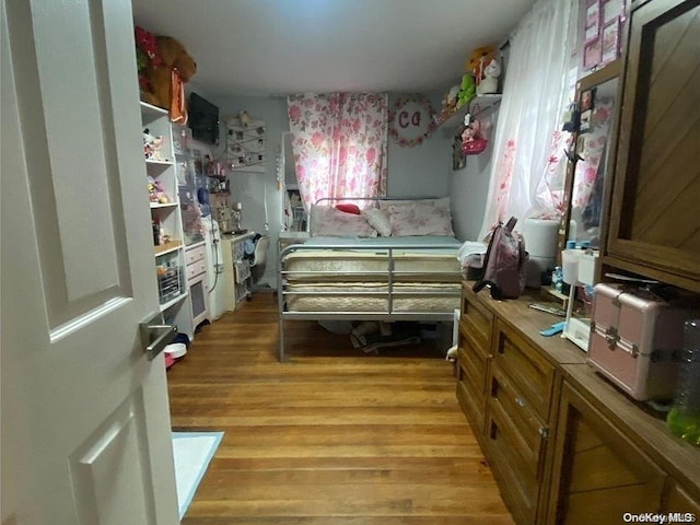 bedroom with light wood-type flooring