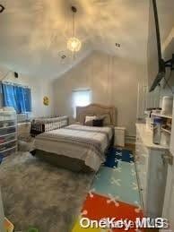 bedroom with vaulted ceiling