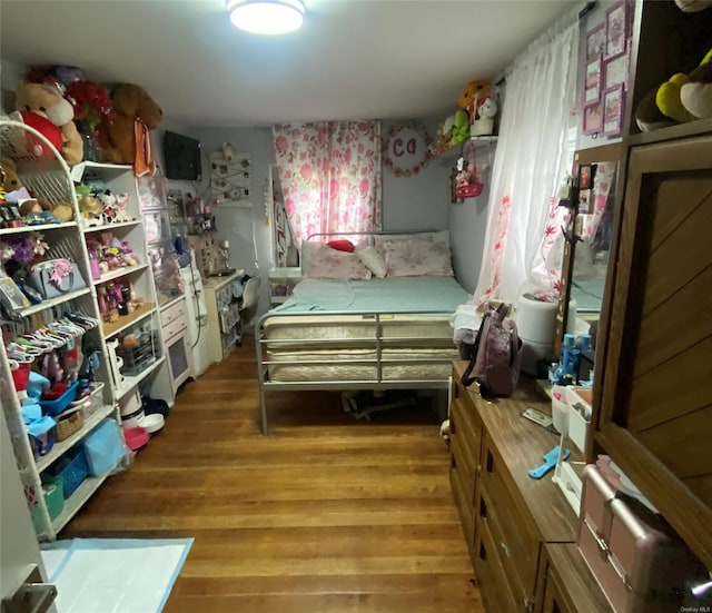 bedroom featuring wood-type flooring