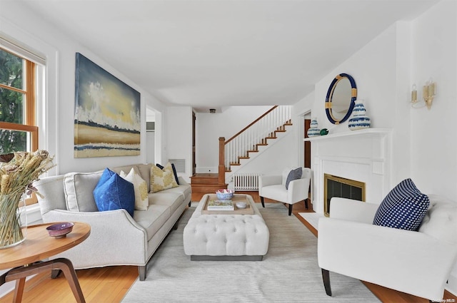 living room featuring hardwood / wood-style flooring and radiator heating unit