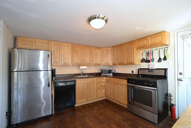 kitchen with dark hardwood / wood-style floors, sink, stainless steel appliances, and light brown cabinetry