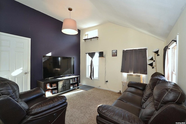 living room featuring carpet, vaulted ceiling, and radiator