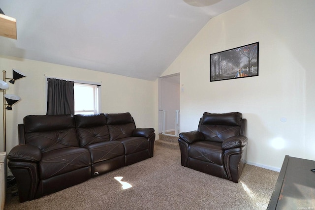 living room featuring carpet flooring and vaulted ceiling