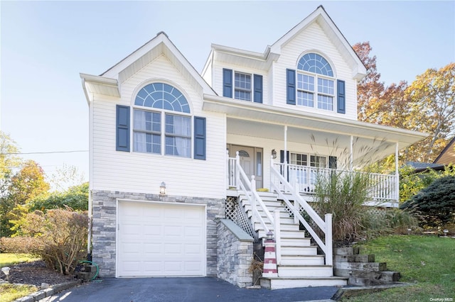 view of front facade with a porch and a garage