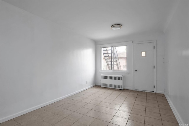 tiled entrance foyer with radiator heating unit