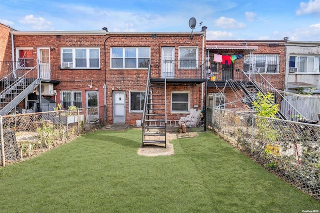 rear view of property featuring a yard