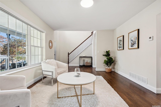 sitting room featuring dark hardwood / wood-style flooring