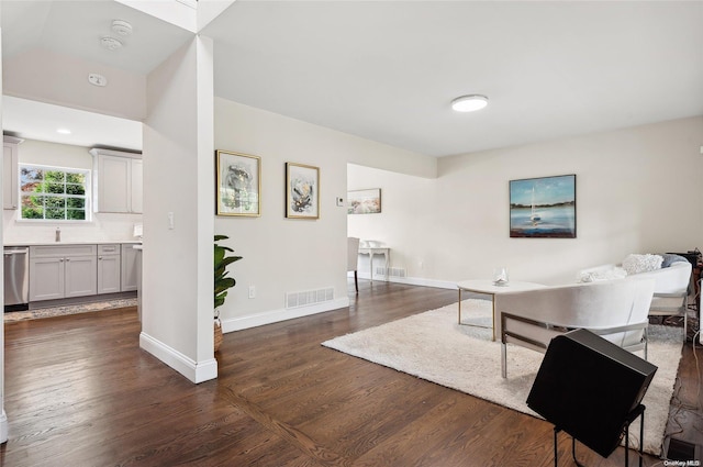 living room with dark hardwood / wood-style floors