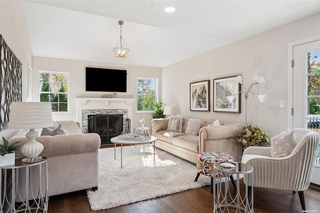 living room with a fireplace and dark hardwood / wood-style floors