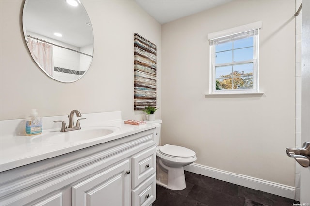 bathroom with tile patterned floors, curtained shower, vanity, and toilet