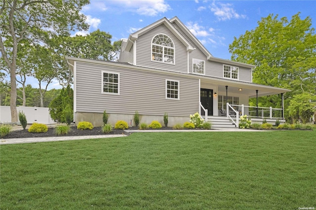 view of front of house featuring covered porch and a front lawn