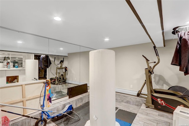 exercise room featuring light hardwood / wood-style flooring